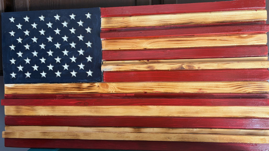 Measuring aproximate 18 by 30 inches, this Rusty American Handcrafted Flag is expertly designed to exhibit a vintage, weathered appearance that delivers authentic rustic charm.