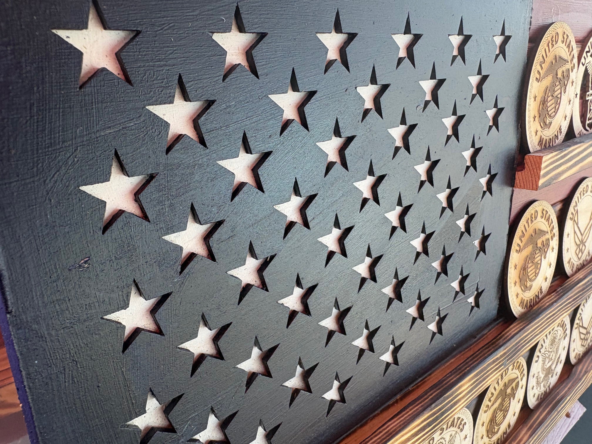 Showcase your remarkable collection of coins with pride using this stunning American flag challenge coin display. Crafted from high-quality wood, this American-made flag not only honors your experiences but also adds a touch of patriotism to any space.