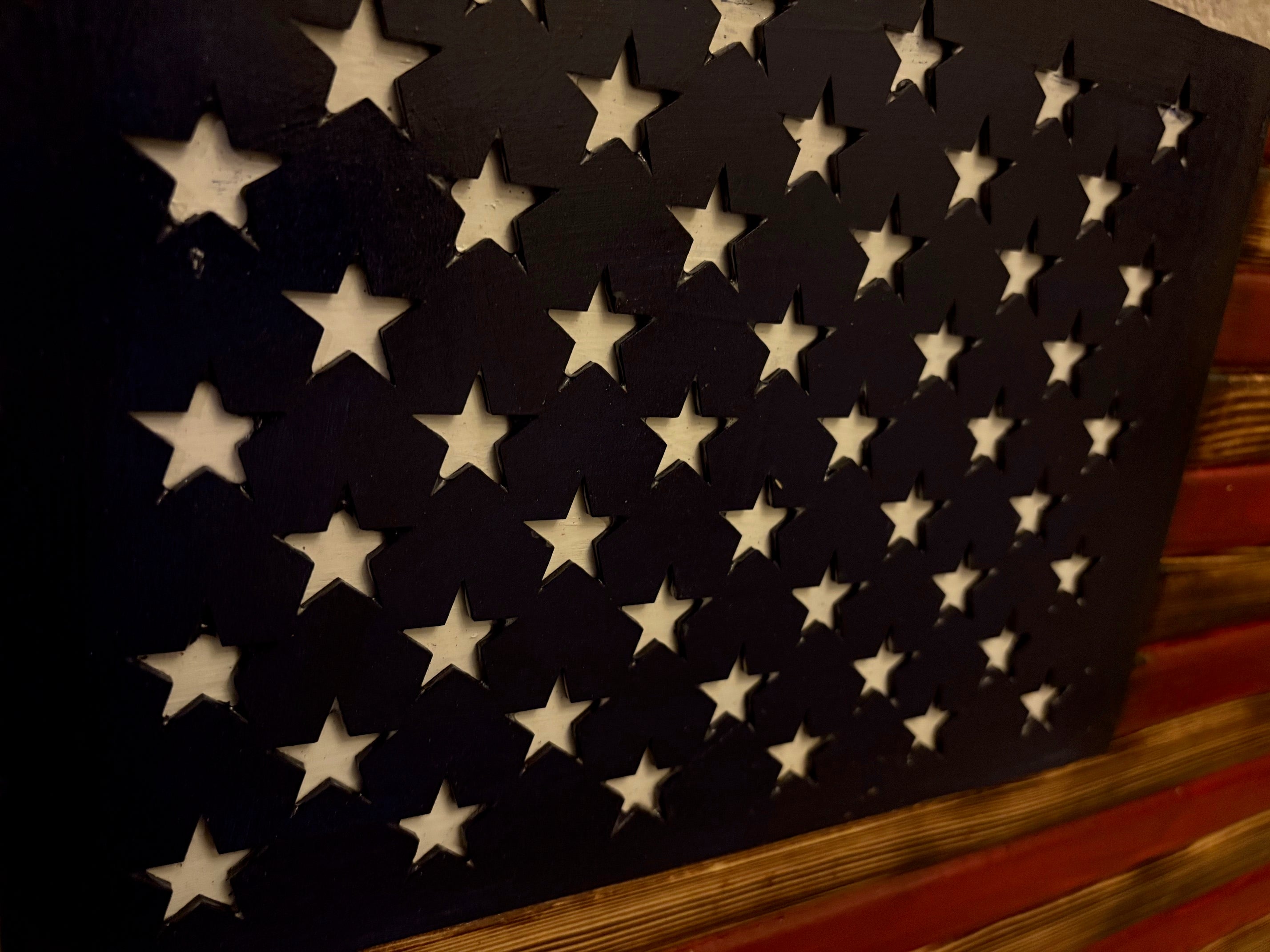 Measuring aproximate 18 by 30 inches, this Rusty American Handcrafted Flag is expertly designed to exhibit a vintage, weathered appearance that delivers authentic rustic charm.