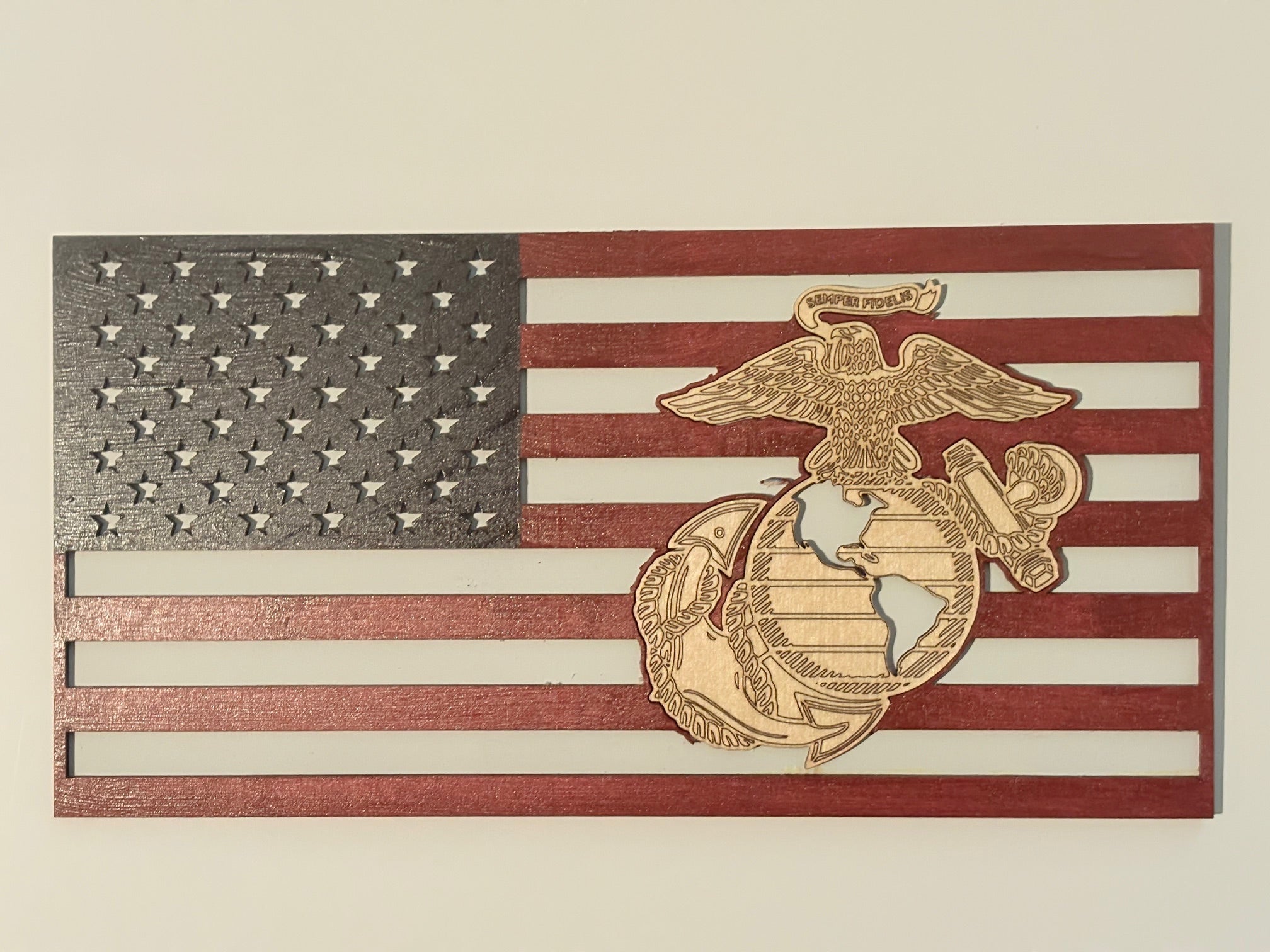 This design features the Marine logo expertly incorporated into the American flag, making.